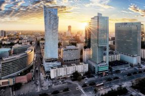 Warsaw city with modern skyscraper at sunset, Poland