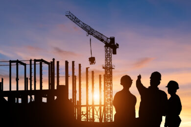 Silhouette Teams of Business Engineers looking for blueprints in construction
