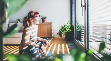 Young woman doing exercise at home.