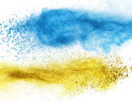 Blue and yellow powder explosion isolated