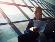 Portrait,Of,Young,Elegant,Woman,Sitting,In,Modern,Office,Interior