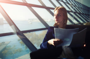 Portrait,Of,Young,Elegant,Woman,Sitting,In,Modern,Office,Interior