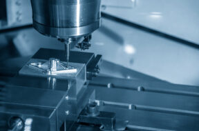 The CNC milling machine hi-precision cutting the aluminium parts