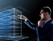 businessman in glasses with virtual building