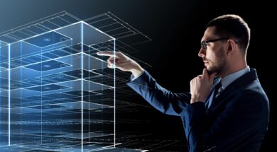 businessman in glasses with virtual building