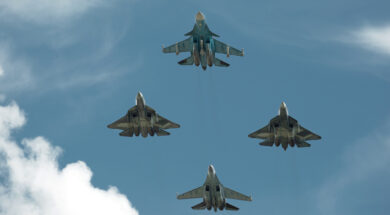 Group of jet fighters make a figure in air during airshow. Aerob