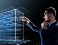 businessman in glasses with virtual building