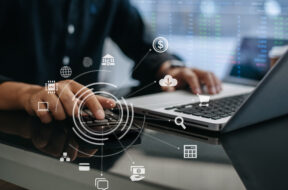 Businessman calculating online stock trading Stock brokers looking at graphs, indices and numbers on tablets and laptops. business success concept.