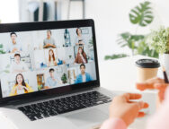 Young Asia businesswoman using laptop talk to colleague about pl